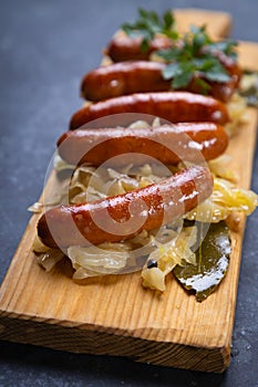 Grilled german sausage links with sauerkraut