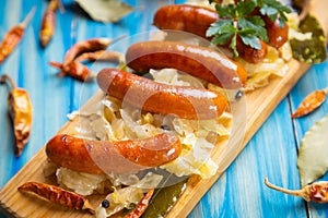 Grilled german sausage links with sauerkraut