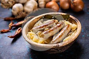 Grilled german sausage links with sauerkraut