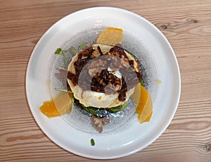 Grilled Goats cheese salad on a round plate