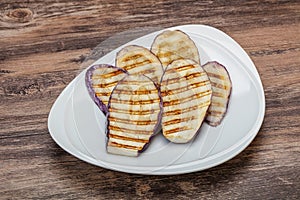 Grilled graffiti eggpant slices with oil