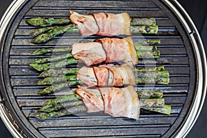 Grilled green asparagus wrapped with bacon