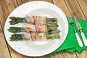 Grilled green asparagus wrapped with bacon