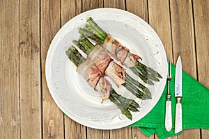 Grilled green asparagus wrapped with bacon