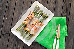 Grilled green asparagus wrapped with bacon