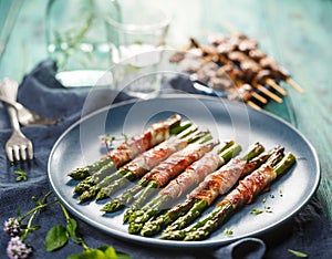 Grilled green asparagus wrapped with bacon