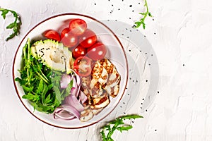 Grilled Halloumi cheese, tomatoes, avocado, and arugula. Vegan food. Diet menu. Top view. Flat lay