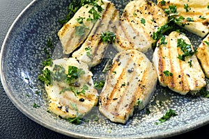 Grilled Haloumi Cheese in Bowl topped with parsley