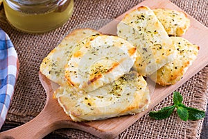 Grilled haloumi cheese with herbs on a cutting board