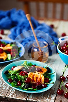 Grilled halumi cheese salad with berries.