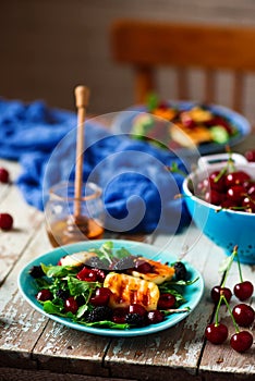 Grilled halumi cheese salad with berries.