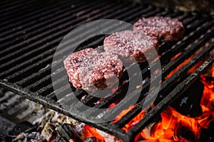 Grilled hamburgers on charcoal coals