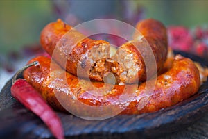Grilled homemade sausage with potatoes