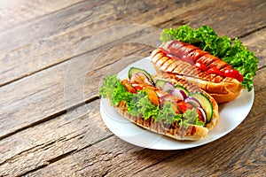 Grilled Hot Dogs on the wooden table