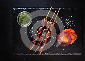 Grilled kebab with chicken hearts. Grilled chicken hearts. Barbecue of grilled chicken hearts. Appetizer for beer. Fast