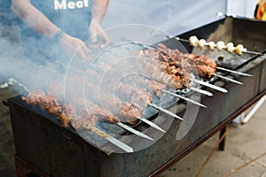 Grilled kebab on metal skewer, barbecue