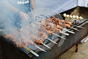 Grilled kebab on metal skewer, barbecue