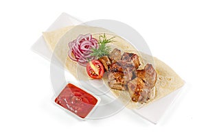 grilled kebab with pita bread and sauce on white background for restaurant menu, studio shooting 1