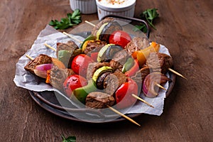 Grilled kebabs with meat, mushrooms and vegetables