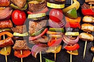 Grilled kebabs with meat, mushrooms and vegetables