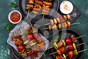 Grilled kebabs with meat, mushrooms and vegetables