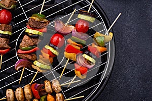 Grilled kebabs with meat, mushrooms and vegetables