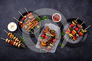 Grilled kebabs with meat, mushrooms and vegetables