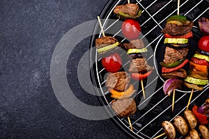 Grilled kebabs with meat, mushrooms and vegetables