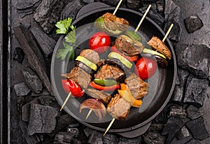 Grilled kebabs with meat, mushrooms and vegetables