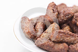 Grilled Kebabs served on the plate with copy space above white background