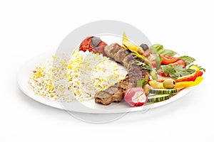 Grilled Lamb Kebab Off The Skewer On White Plate