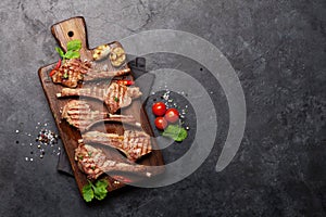 Grilled lamb ribs on cutting board