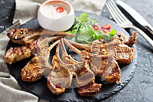 Grilled lamb ribs with spices and yoghurt sauce
