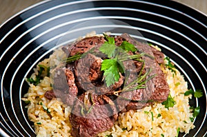 Grilled lamb on saffron rice