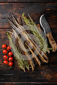 Grilled lamprey , on old dark  wooden table background, top view flat lay