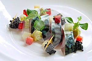 Grilled mackerel fish with blackberries. photo
