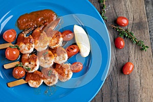 Grilled marinated prawns with cherry tomato confit