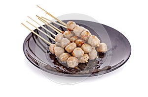 Grilled meat ball with sweet spicy sauce isolated on white background.