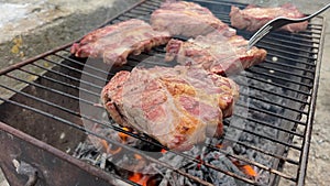 Grilled meat with fire. Food and cuisine. Meat steak cooking over flaming grill. Grilled meat. Grilled marbled beef