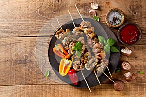 Grilled meat (kebab) with vegetables and sauce