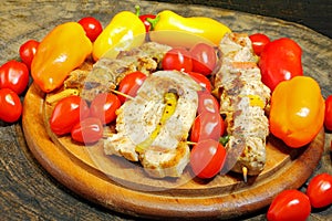Grilled meat kebabs with vegetables