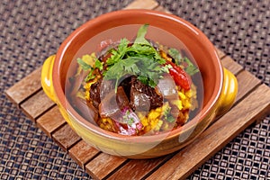 Grilled meat with raditional spanish rice decorated parsley