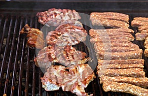 Grilled meat rolls mici or mititei and beef steak