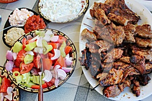 Grilled meat and salads photo