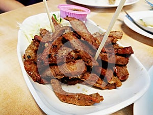 Grilled meat slices with spicy soy sauces