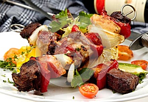 Grilled meat on a spit photo