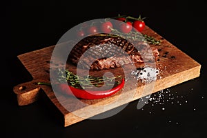 Grilled meat steak on a cutting Board with salt