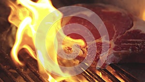 Grilled meat steak. Food and cuisine. Beef steak cooking over flaming grill. Grilled steaks. Grilled marbled beef steak