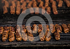 Grilled minced meat rolsls called Mici in traditional Romanian c