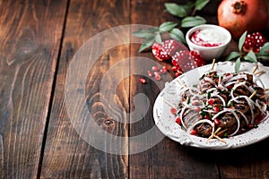 Grilled minced meat skewers kebabs with onions, sumac and pomegranate